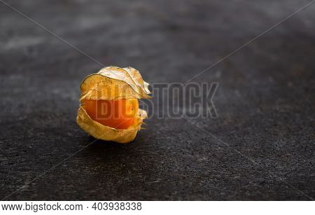 Cape Gooseberry Or Physalis Minima On Wood Background. Tropical Fruit And Food For Health Concept.
