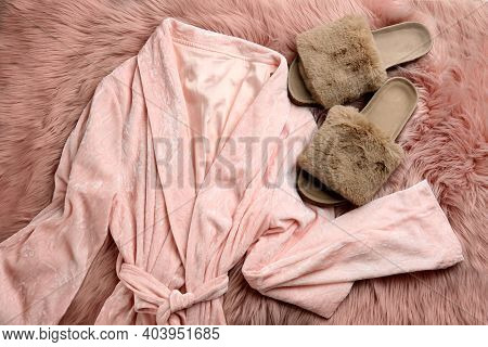 Pair Of Fluffy Slippers And Robe On Fuzzy Carpet, Flat Lay. Comfortable Home Outfit