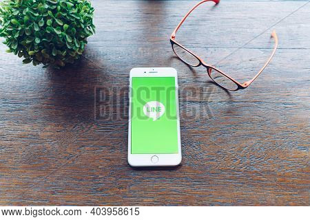 Chiang Mai, Thailand - Sep. 20,2020: Apple Iphone 8plus With Line Apps And Glasses On Wooden Table. 