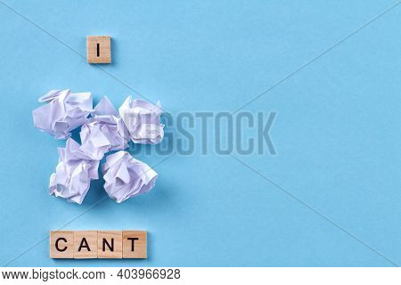 Negative Assessment Of Ones Capabilities. I Cant Written With Wooden Blocks. Pile Of Paper Balls Iso