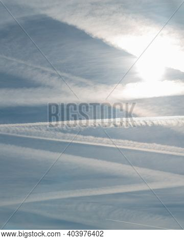 Beautiful White Wakes Contrails Traces In A Blue Sky In Madrid, Spain
