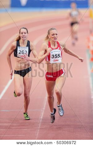 VIENNA, AUSTRIA - JANUARY 29 Line Kloster (#355 Norway) places 3rd in the women's 400m event on January 29, 2013 in Vienna, Austria.