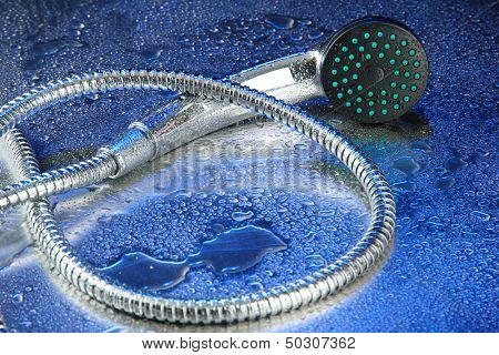 Shower and drops, on blue background 