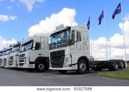 White Volvo Trucks in a Row