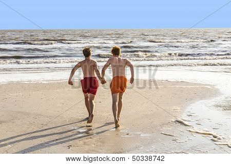 Teenager Enjoys Jogging Along The Beach