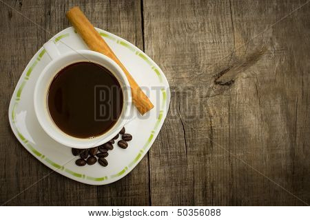 Coffee Cup With Beans And Cinnamon Stick