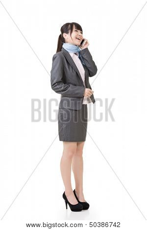 Young asian business woman using cell phone. Full length portrait. Isolated on the white background.