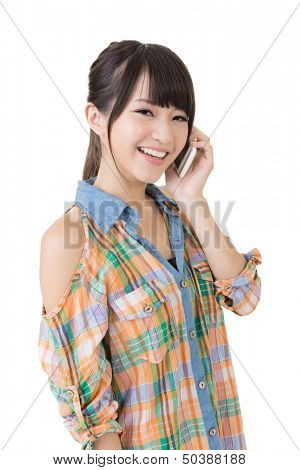 Young pretty asian woman talking on a cell phone. Half length potrtait. Isolated on the white background.