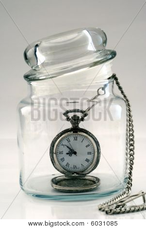 Old pocket watch in a glass jar â€“ Time in a Bottle
