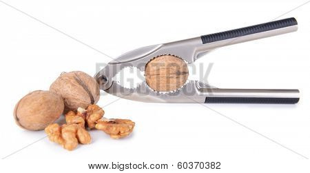 Nutcracker with walnuts isolated on white