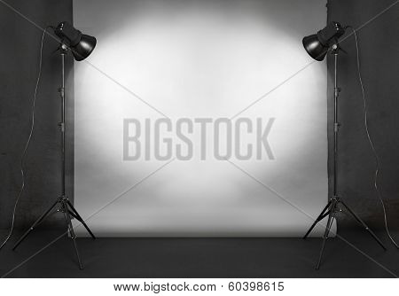 photo studio in old grunge room with concrete wall and paper background 