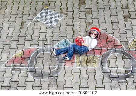 Little Boy Having Fun With Race Car Picture Drawing With Chalk