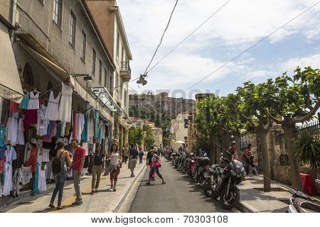 ATHENS, GREECE - MAY 10, 2014: Athenians and tourists in center of city. Tourism is a decisive sector of hope for Greek economy - In the year Greece receives about 18 million tourists.