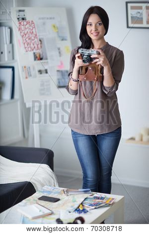 Woman is a proffessional photographer with camera