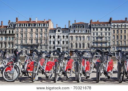 LYON FRANCE - AUGUST 2014 - Shared bikes are lined up in the streets of Lyon France. Velo'v Grand Lyon launched in May 2005 has over 340 stations and 3000 bikes throughout the Grand Lyon area.
