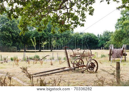 Peasant Household With Abandoned Farm Equipment
