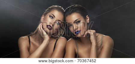 Two Beauty Ladies Together. Wet Hair And Violet Lips.