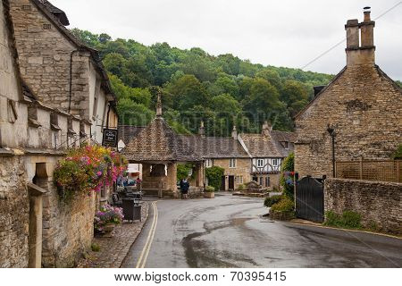 WILTSHIRE, CHIPPENHAM, UK - AUGUST 9, 2014: Castle Combe, unique old English village with luxury hot