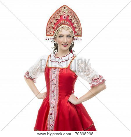 Smile young woman hands on hips portrait  in russian traditional costume