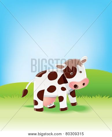 Cow on green field