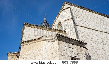 Cathedral with stone wall and blue sky