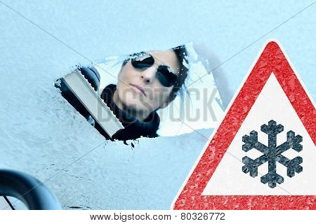 Winter Driving - Woman Scraping Ice from a Windshield