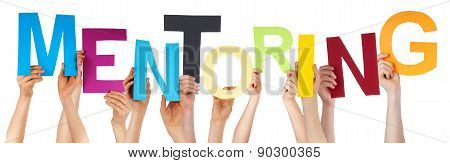 Many People Hands Holding Colorful Word Mentoring