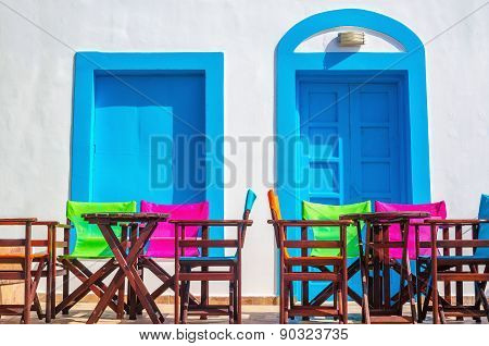 Colorful Greek restaurant table and chairs, Greece