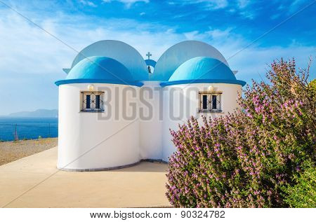 Church with iconic blue roof on Greek island