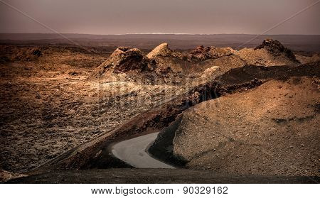 beautiful landscape with mountain road in Timanfaya National Park in Lanzarote, Canary Islands