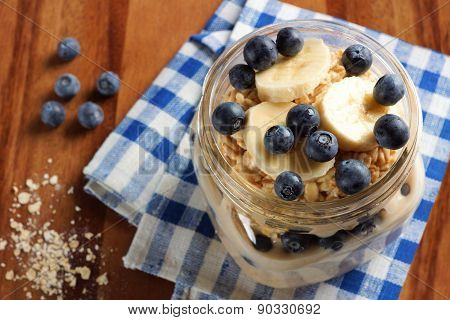 Blueberry and banana breakfast oatmeal in mason jar