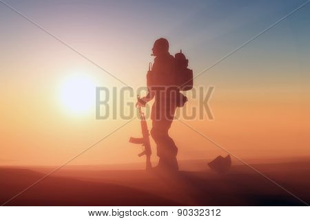 Silhouette of a soldier against the sun.