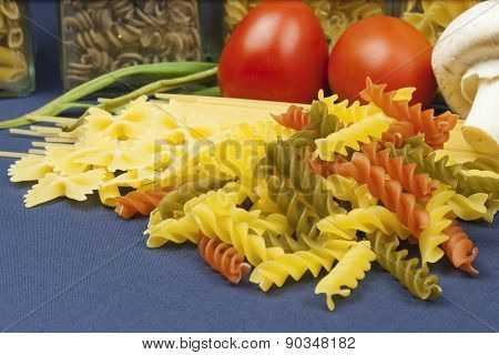 Various types of pasta on the table, homemade food preparation