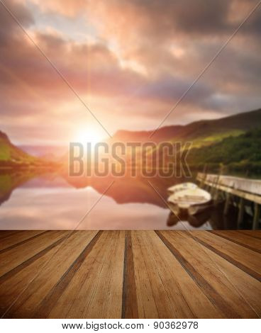 Sunrise Over Lake With Boats Moored At Jetty With Wooden Planks Floor