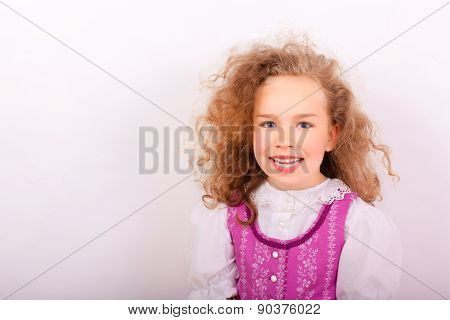 Portrait of a small girl in traditional Bavarian clothes