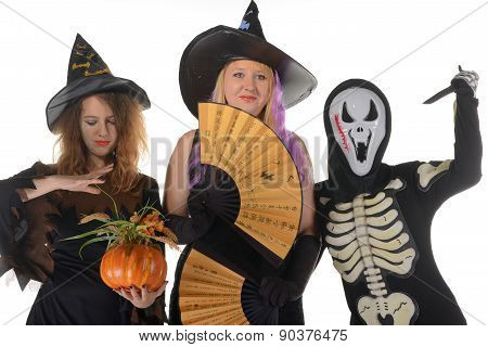 Three women witches posing in scary outfits