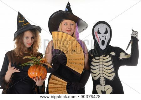 Three women witches posing in scary outfits