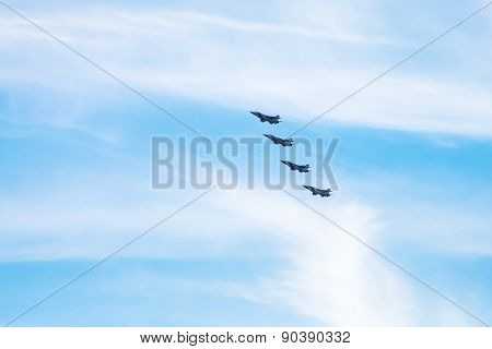 Four Military Fighter Aircrafts In Cloudy Sky