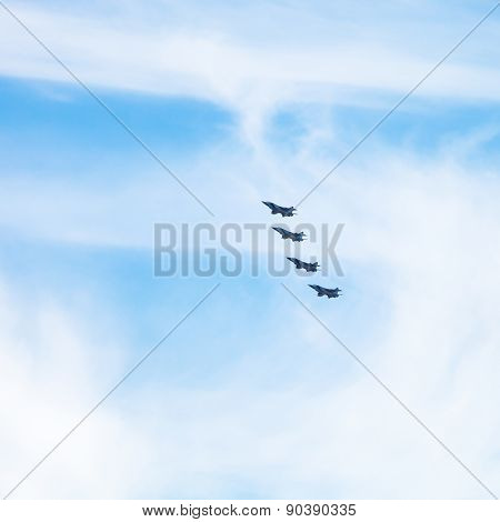 Four Military Fighter Jets In Cloudy Sky