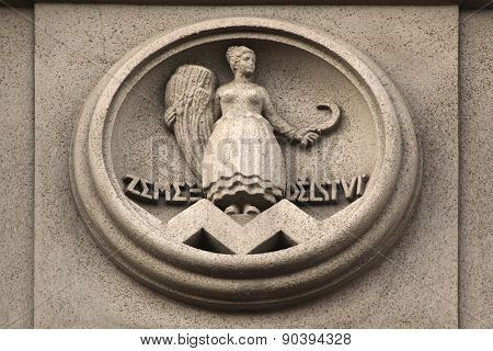 Allegory of Agriculture. Building decoration at Bubenecska Street in Prague, Czech Republic.