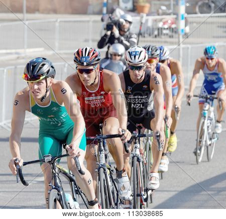 Group Of Male Cycling Triathlon Competitors Fighting