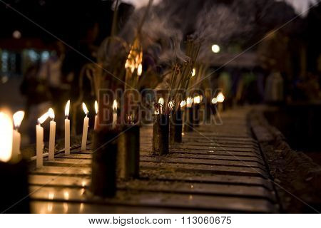 Burning Incense Sticks And Candle