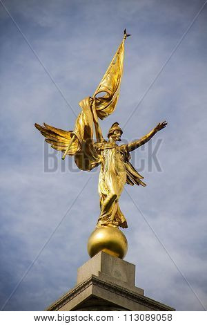 golden goddess with cloudy dark sky, Washington D.C.