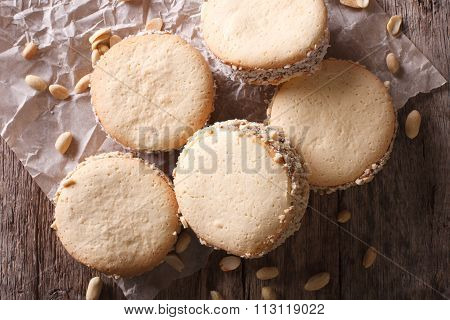 Alfajores Cookies On Paper Close-up On The Table. Horizontal Top View