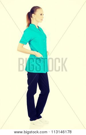 Beautiful caucasian woman doctor looking up.