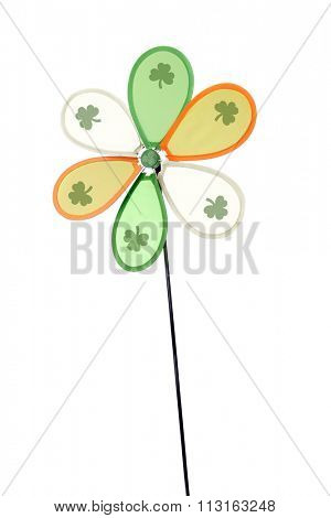 A green, orange and white Irish pinwheel with a shamrock on each blade.  Isolated on white.