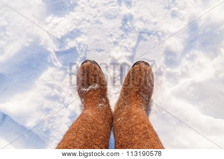 Russian Traditional Winter Footwear - Valenki. Winter Sunny Day, Top View On Feet Felted Wool Boots.