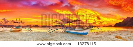 Traditional philippine boat bangka at sunset time