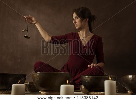 Woman Playing Tingsha (tibetan Bells)