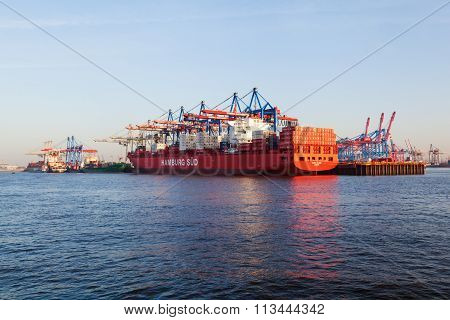 HAMBURG, GERMANY - MARCH 10: container ship Santa Clara of the Hamburg SÃ?Â¼d shipping company in the Burchardkai on March 10, 2014. Burchardkai is the largest container terminal of the Hamurg port.